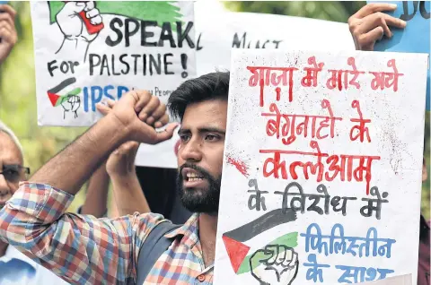 ?? AFP ?? Indian students and social activists chant slogans against the United States and Israel during a demonstrat­ion in New Delhi on Thursday.
