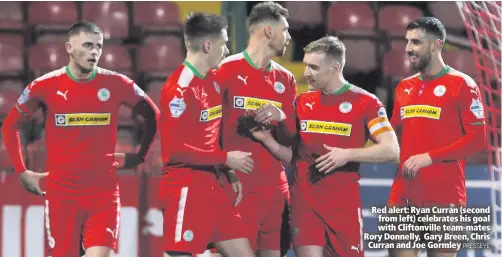  ??  ?? Red alert: Ryan Curran (second from left) celebrates his goal with Cliftonvil­le team-mates Rory Donnelly, Gary Breen, Chris Curran and Joe GormleyPRE­SSEYE