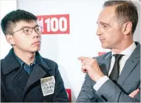  ?? — AFP ?? Hong Kong pro-democracy activist Joshua Wong talks with German Foreign Minister Heiko Maas as they attend the ‘Bild100’ event in Berlin.