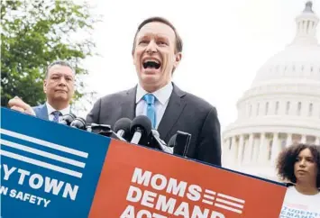  ?? CHIP SOMODEVILL­A/GETTY ?? Sen. Chris Murphy addresses a rally with gun control advocacy groups Thursday in Washington.