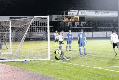  ?? PETER HARMAN ?? Kerry Morgan scores number two for Merthyr Town against Stratford