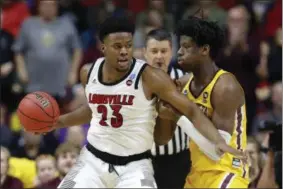  ?? CHARLIE NEIBERGALL - THE ASSOCIATED PRESS ?? Louisville center Steven Enoch (23) drives around Minnesota center Daniel Oturu, right, during a first round men’s college basketball game in the NCAA Tournament, Thursday, March 21, 2019, in Des Moines, Iowa.