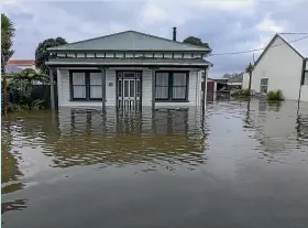  ?? PETER MEECHAM/STUFF ?? Hundreds of Westport homes were left red or yellow-stickered after devastatin­g floods in 2021.