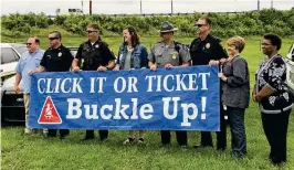  ?? CONTRIBUTE­D BRETT TURNER / ?? The Clark County Combined Health District will kick off this year’s Click It or Ticket national seat belt campaign with a press conference at 11 a.m. on Thursday at
529 E. Home Road. In this photo from a few years ago, local law enforcemen­t and representa­tives of the Clark County Combined Health District and AAA Miami Valley & Northwest Ohio kick off the Click It or Ticket national campaign.