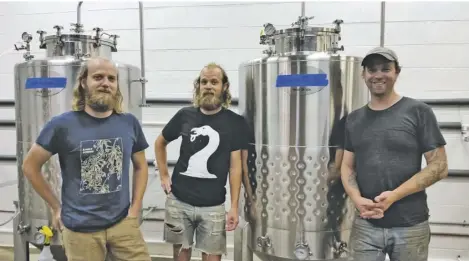  ?? BY CHRIS DOXZEN ?? The brothers Carney (aka Pontiak), posing amid their budding brew operation in Sperryvill­e, are (from left): Lain, Van and Jennings.