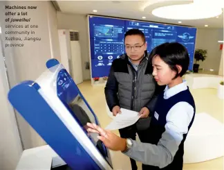  ??  ?? Machines now offer a lot of juweihui services at one community in Xuzhou, Jiangsu province