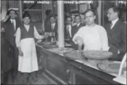  ?? BAIN NEWS SERVICE — LIBRARY OF CONGRESS VIA THE ASSOCIATED PRESS ?? A 1910 photo shows a Syrian pastry counter in the Little Syria neighborho­od of Lower Manhattan in New York.