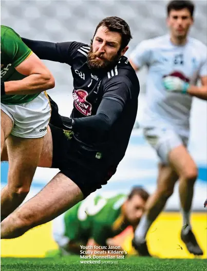  ?? SPORTSFILE ?? Youth focus: Jason Scully beats Kildare’s Mark Donnellan last weekend