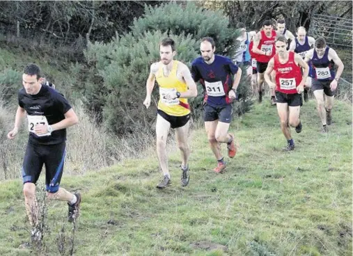  ??  ?? LEADING THEWAY: Gordon Lennox heads field in the North of Scotland hill running championsh­ips at Strathpeff­er