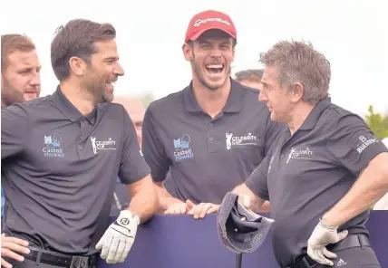  ??  ?? > Welsh team-mates Gethin Jones, Gareth Bale and Jonathan Davies joking at the Celebrity Cup at Celtic Manor Resort