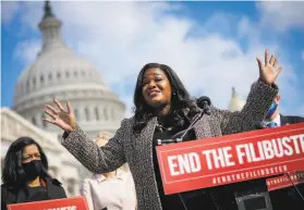  ?? Drew Angerer / Getty Images ?? Rep. Cori Bush, DMo., calls for ending the Senate filibuster at a rally outside the U.S. Capitol on Thursday. “Everything we love is at stake,” she said.