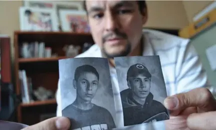  ?? TANYA TALAGA/TORONTO STAR FILE PHOTO ?? Teacher Greg Quachegan holds pictures of Paul Panacheese, left, and Curran Strang, who died while attending Dennis Franklin Cromarty school in Thunder Bay. Six of the seven students who are the subject of a coroner’s inquest beginning next month...