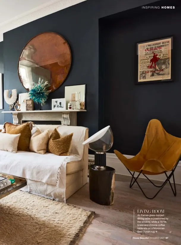  ??  ?? LIVING ROOM
An Eames glass-topped dining table is positioned by the window, while a 1970s brass and chrome coffee table sits on a Moroccan Beni Ourain rug