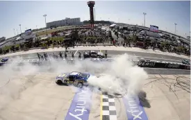  ?? (Tim Nwachukwu/getty Images) ?? Chase Elliott, driver of the #9 NAPA Auto Parts Chevrolet, celebrates with a sweet burnout after winning the Cup Series DURAMAX Drydene 400 presented by Reladyne at Dover Motor Speedway Monday.