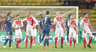  ?? — AFP ?? Monaco players celebrate after winning the French Cup football match between Monaco (ASM) vs Lille (LOSC) at the Louis II Stadium, in Monaco, on April 4, 2017.