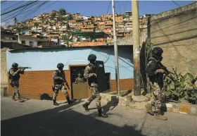  ?? Rodrigo Abd / Associated Press ?? Human rights groups say FAES, an elite commando unit created for anti-gang operations, is now acting against young protesters living in the slums.