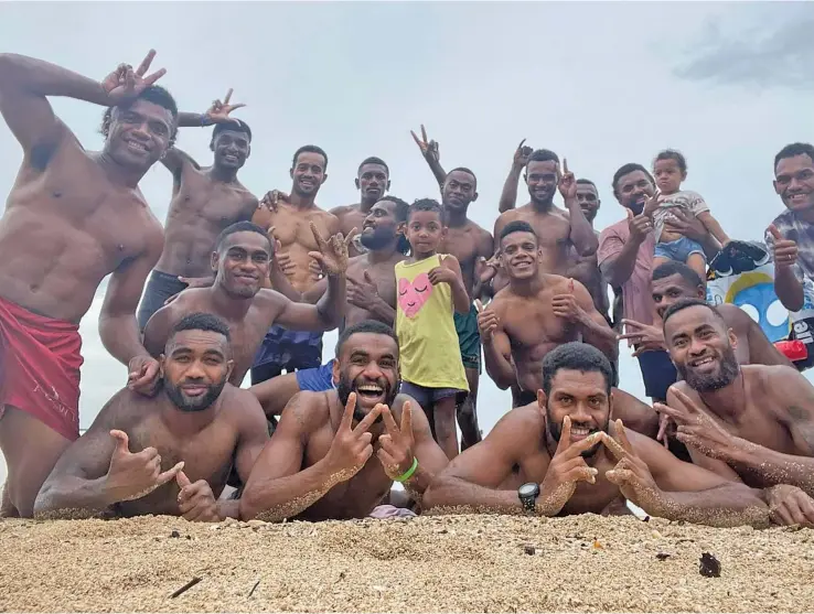  ?? Wadigi Salvo Rugby ?? Former Fijian sevens playmaker Napolioni Bolaca (middle second from right) with the Wadigi Salvo side after training at Saweni Beach, Lautoka on December 23, 2022. Photo: