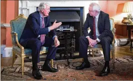  ?? STEFAN ROUSSEAU / GETTY IMAGES ?? Michel Barnier (left), European chief negotiator for the United Kingdom exiting the European Union, and Brexit Secretary David Davis meet for talks at No 10. Downing St. in London on Monday.