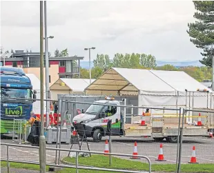  ?? Picture: Steve Macdougall. ?? A drive-through coronaviru­s testing unit for key workers is being set up in the car park at Perth College.