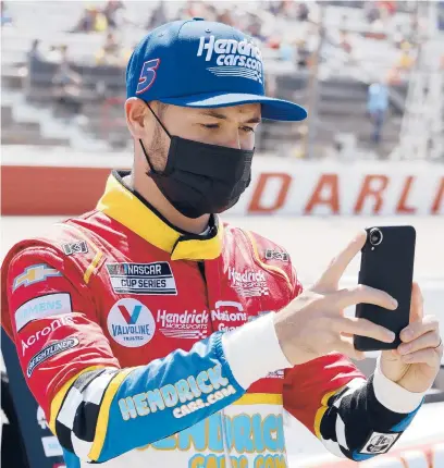  ?? TERRY RENNA/AP ?? Kyle Larson, pictured on May 9 at Darlington Raceway, has formed a bond with Philadelph­ia’s Urban Youth Racing School.
