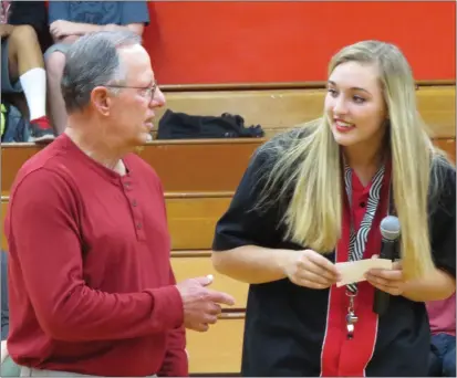  ?? FILE PHOTO ?? Longtime Clear Lake High School softball head coach Gary Pickle was one of four coaches/officials honored into the Coastal Mountain Officials Associatio­n Hall of Fame on Sunday in Kelseyvill­e. Pickle is pictured here in 2015along with one of his former players, Rachel Wingler, during a school ceremony honoring his 23 years as the Cardinals' softball coach. He retired following the 2015 season, which ended with Clear Lake winning a North Coast Section championsh­ip.