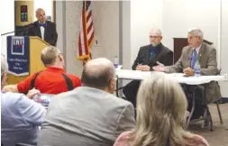  ?? STAFF PHOTO BY C.B. SCHMELTER ?? Georgia District 54 State Sen. Chuck Payne, seated right, and Democratic challenger Michael Morgan, seated left, participat­e in a forum hosted by the League of Women Voters of Dalton Inc. at the Mack Gaston Community Center on Thursday in Dalton.