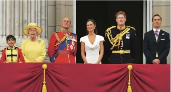  ??  ?? Left With the Queen, the Duke of Edinburgh, Pippa Middleton and Prince Harry after the Duke and Duchess of Cambridge’s wedding