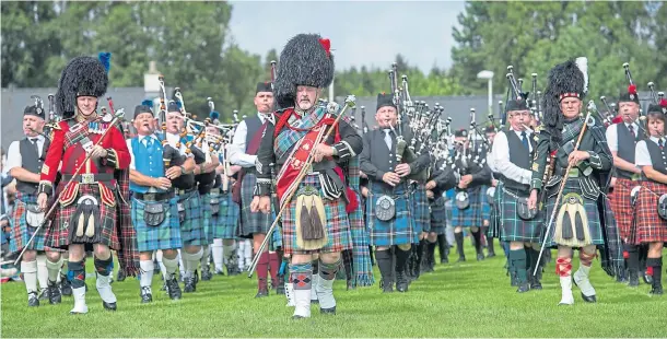  ?? Photograph by Sandy McCook ?? TRADITIONA­L GATHERINGS: Massed pipe bands, pictured at last year’s Nethy Highland Games, Abernethy, are always a popular attraction.