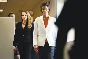  ?? Corey Perrine / Associated Press ?? Andrea Constand (center) walks during a break in testimony at Bill Cosby’s trial in Norristown, Pa. Constand says Cosby knocked her out with pills and then sexually assaulted her.