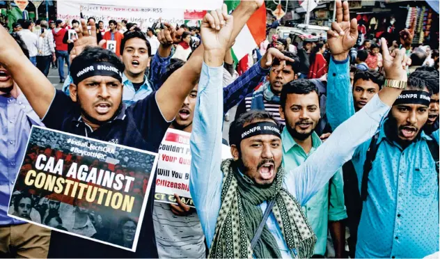  ?? Associated Press ?? ↑
Students of different universiti­es shout slogans during a protest rally against CAA in Kolkata on Monday.