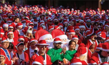  ?? STEVE MARCUS FILE (2022) ?? Runners, dressed as Santa Claus, wait for the start of the annual Great Santa Run on Dec. 3, 2022, in downtown Las Vegas.