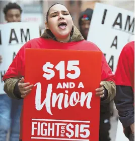  ?? STAFF FILE PHOTO BY NANCY LANE ?? A WIN: Barbara Fisher marches in a protest seeking a $15 minimum wage in February.