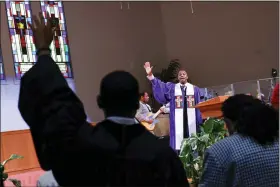  ?? EDUARDO MUNOZ ALVAREZ - THE ASSOCIATED PRESS ?? Rev. Dante Quick, preaches during a church service at the First Baptist Church of Lincoln Gardens on May 22, in Somerset, N.J. Quick has made Black mental health an area of focus for his Baptist congregati­on. He has also attended to his own mental health needs and advises his congregant­s and seminarian­s to do the same.