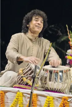  ??  ?? Tabla player Zakir Hussain, who has performed with Yo-Yo Ma and George Harrison, brings his Celtic-Indian ensemble to town Saturday.