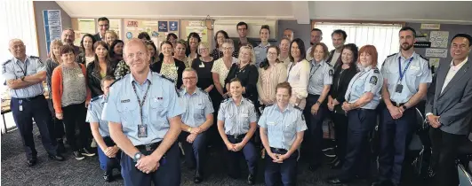  ?? PHOTO: GREGOR RICHARDSON ?? One, and growing . . . Whangaia Nga Pa Harakeke programme manager Senior Sergeant Craig Dinnissen celebrates the programme’s first birthday with participat­ing social agencies, iwi and police, at the South Dunedin Police Station yesterday.