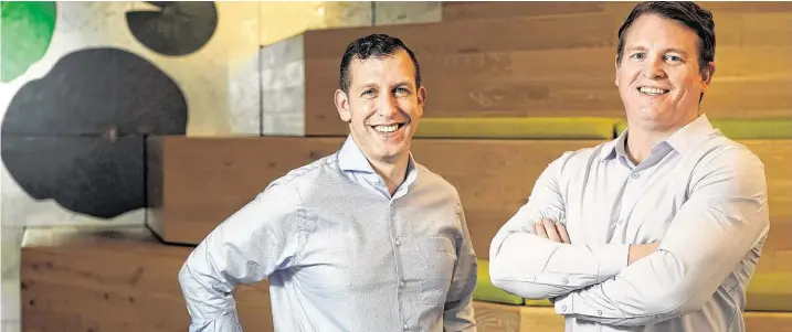  ?? Melissa Phillip / Staff photograph­er ?? Entera founders Martin Kay, left, and Robert Salmons will use new capital to expand the reach of Entera’s technology platform.