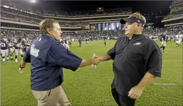  ?? AP Photo ?? Patriots head coach Bill Belichick and Chip Kelly shake hands after the Eagles’ first preseason game.