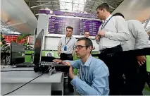  ?? PHOTO: REUTERS ?? Technician­s try to sort out flight timetables at Kiev’s main airport in Ukraine after a cyberattac­k targeted government ministries, banks, utilities, and important infrastruc­ture and companies.