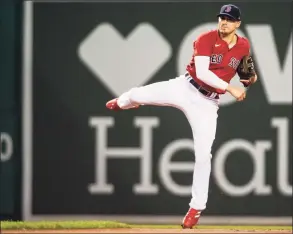  ?? Kathryn Riley / Getty Images ?? The Red Sox’s Kiké Hernandez throws to first base in the sixth inning against the Tampa Bay Rays at Fenway Park on Aug. 10.