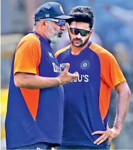  ??  ?? A file photo of India bowling coach Bharat Arun (left) with Shardul Thakur.