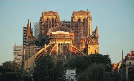  ?? THOMAS COEX / AGENCE FRANCE-PRESSE ?? The Notre Dame cathedral in Paris at sunrise on Tuesday, the 29th day of a lockdown in France to stop the spread of the novel coronaviru­s.