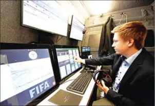  ?? FRANCK FIFE/AFP ?? A technician checks the video arbitratio­n system used in the friendly between France and Spain at the Stade de France stadium on Tuesday.