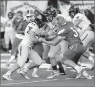  ?? NWA Democrat-Gazette File Photo/ANDY SHUPE ?? Linebacker Hayden Cox (right) and the Farmington Cardinals take on Gravette tonight.