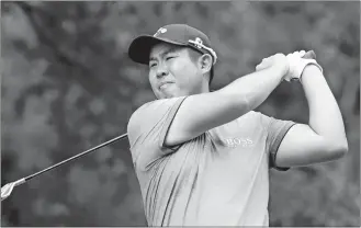  ?? CHRIS SEWARD/AP PHOTO ?? Byeong Hun An watches his tee shot on the fourth hole hole during the third round of the Wyndham Championsh­ip on Saturday at Sedgefield Country Club in Greensboro, N.C.