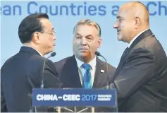  ??  ?? Chinese Premier Li Keqiang (left) chats with his Bulgarian counterpar­t Boyko Borisov (right) and Hungarian Prime Minister Viktor Orban (center) during summit of 16 central and eastern European leaders and the Chinese Premier as special guest on...