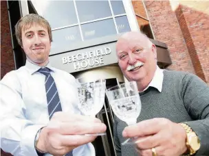  ??  ?? ●● Chris Knott and Phil Wood celebrate the launch of corporate recovery firm Barrington­s Corporate Recovery in Lyme Green, Macclesfie­ld