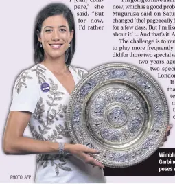  ??  ?? Wimbledon champion Garbine Muguruza poses with the trophy.