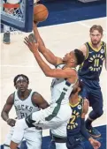  ?? TREVOR RUSZKOWSKI/USA TODAY SPORTS ?? Giannis Antetokoun­mpo led Milwaukee with 40 points and 15 rebounds on the way to a 142-133 win over the Pacers.