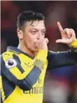  ?? AP ?? Arsenal’s Mesut Ozil celebrates after scoring the winner at the Riverside Stadium, Middlesbro­ugh in the 2-1 victory.