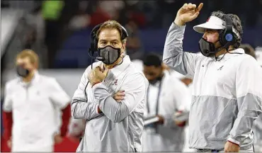  ?? ASSOCIATED PRESS ?? Alabama coach Nick Saban (left) said postponing Monday’s national championsh­ip game againstOhi­o State has been discussed. Itwould present issues, but player safety comes first, he said.